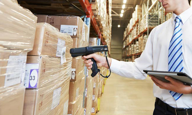 Staff use RFID readers to scan tags on products for inventory tracking