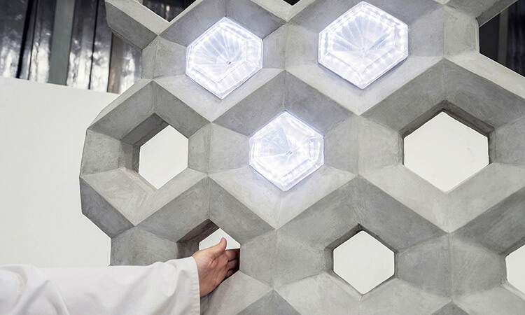 Sensors and actuators inside smart concrete respond to human touch and emit bright lights