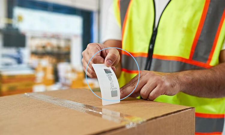Workers use RFID tags in supply chain management to track the whereabouts of goods