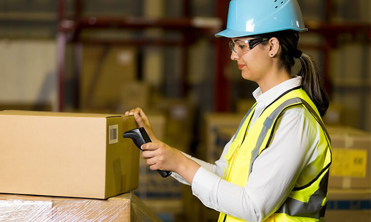 Workers are using RFID readers to scan tags on goods